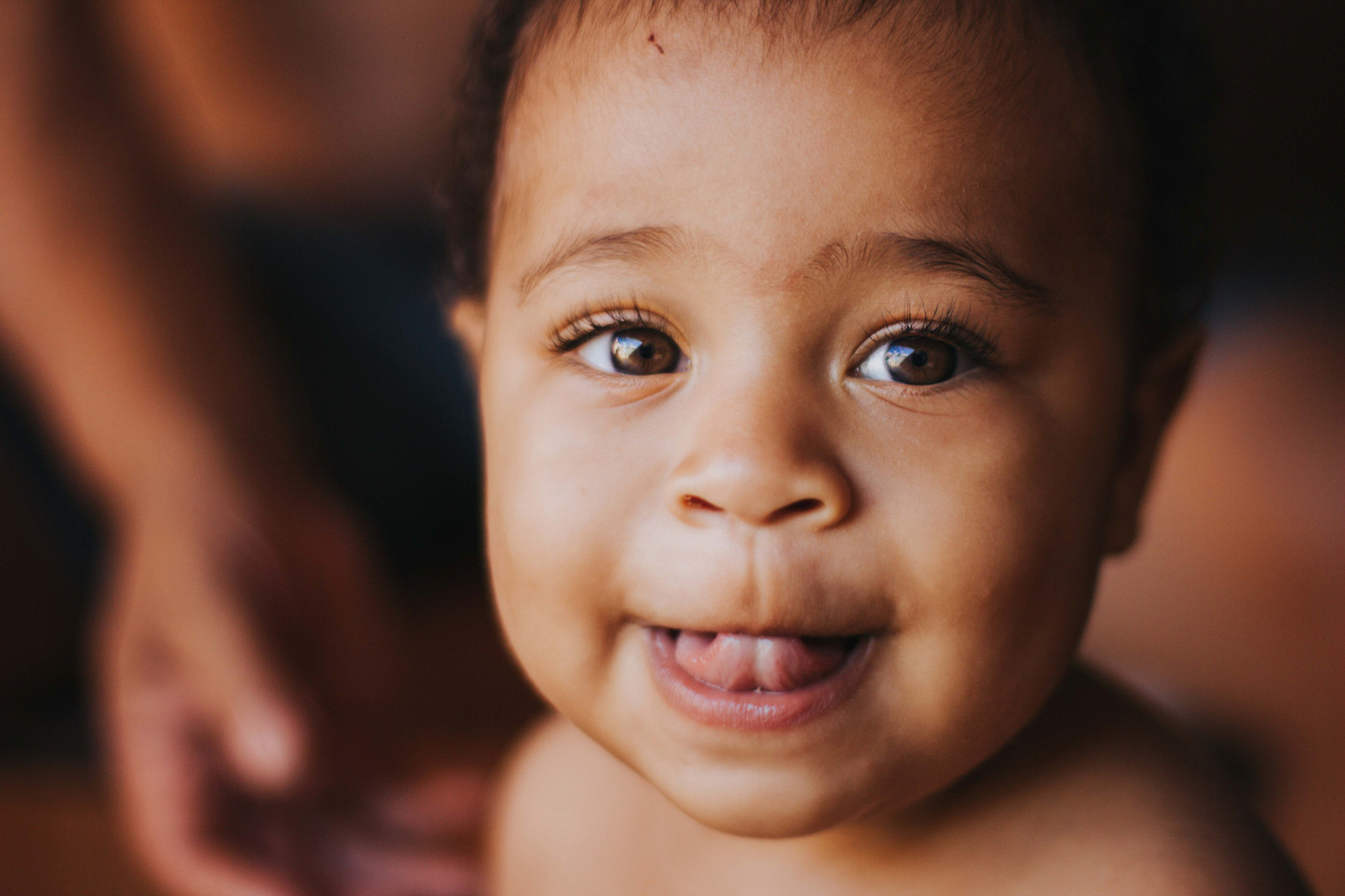 Baby smiling at camera at a local adoption agency.
